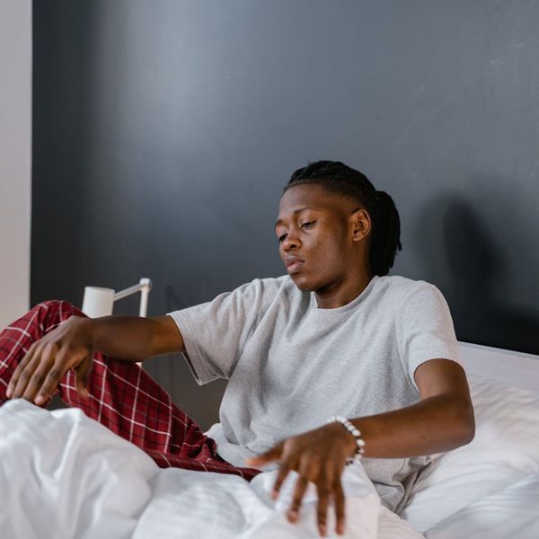 Man peacefully waking up and stretching