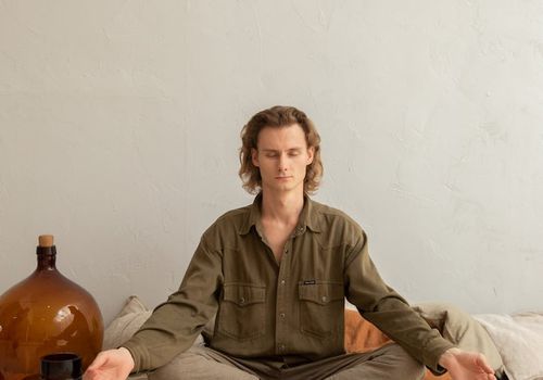 Person meditating in a quiet room